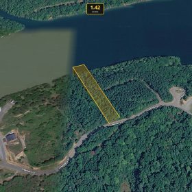 Vacant lot with paved road frontage, serene lake access and resort style amenities in Pittsylvania County, VA